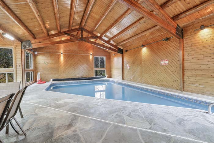 Cabin at the Crossroads Indoor pool and hot tub area.